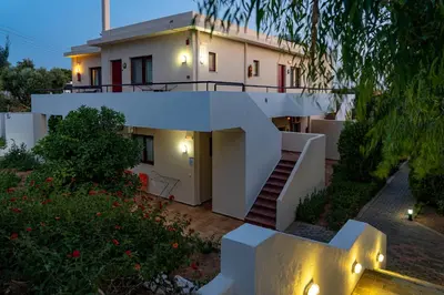 a house with a staircase in front of it at Angela Studios Pefkos in Pefki Rhodes