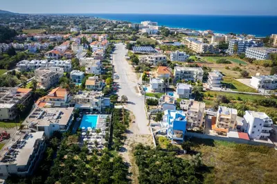 an aerial view of a city with the ocean at Ilyssion Holidays Hotel in Ialyssos
