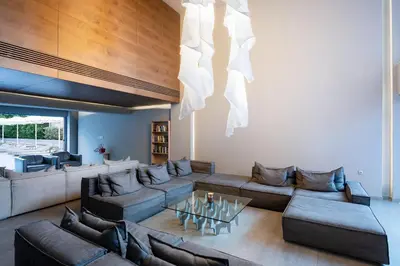 a living room with a couch and a table at Oktober Downtown Boutique Hotel in Rhodes Town