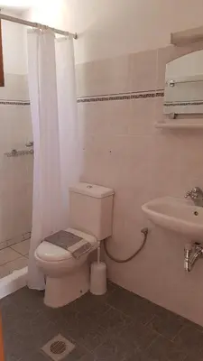 a bathroom with a toilet and a sink at Andreas Studios in Pefki Rhodes