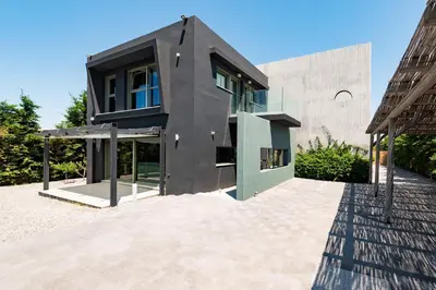 a modern house with a black roof at Villa Eleven in Ialyssos
