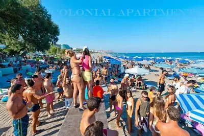 a crowd of people on a crowded beach at COLONIAL FAMILY apartment #4 ground floor in Faliraki
