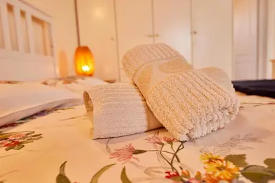 two towels sitting on top of a bed at Edem Paradise in Plimmiri