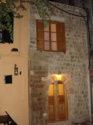 an entrance to a building with a door and windows at Suite Grand Maitre Rodos in Rhodes Town
