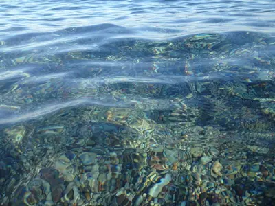 a group of rocks under the water at Sea Breeze Villas in Lachania