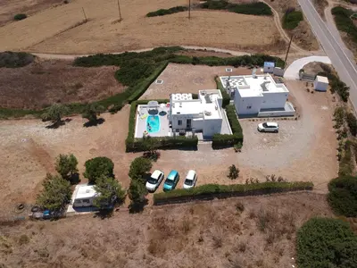 an aerial view of a house with a parking lot at Sea Breeze Villas in Lachania