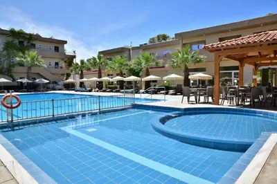 a swimming pool in front of a hotel at Marathon Hotel - All Inclusive in Kolimbia