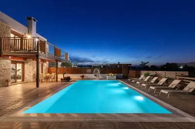 a swimming pool in the middle of a house at Sperveri Enalio Villas - Heated Pool in Kolimbia