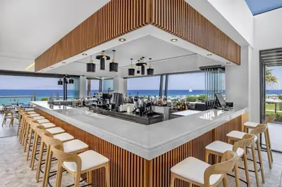 a bar with a view of the ocean at Sun Beach Resort in Ialyssos