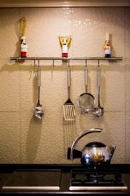 a kitchen counter with utensils and a pot on a stove at Lindos Villa Estelle in Líndos