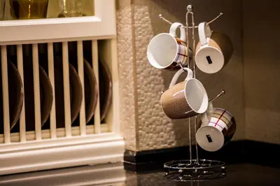 a group of coffee cups and a microphone on a rack at Lindos Villa Estelle in Líndos