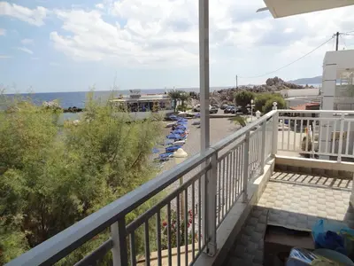 a balcony with a view of the ocean at Stamatia's House in Haraki