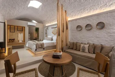 a living room with a bed and a couch at Kaminos Boutique Hotel in Symi