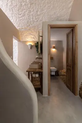 a bathroom with a sink and a toilet at Kaminos Boutique Hotel in Symi