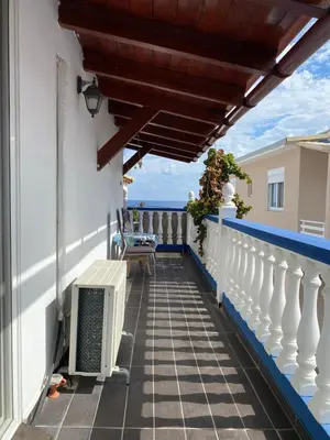 a balcony with a view of the ocean at Nikos Studios Meltemi Family Suite Penthouse in Archangelos