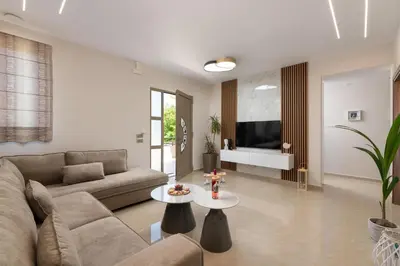 a living room with a couch and a table at Aelia Luxury Apartment-with swimming pool in Afantou