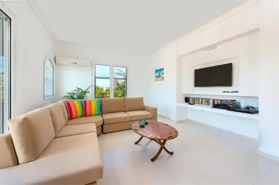 a living room with a couch and a table at Villa Giovanni in Faliraki
