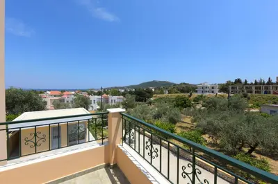 a balcony with a view of the city at Athina's Apartment in Olive Grove in Faliraki