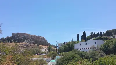 a view of a mountain with a white building at Aphrodite White Studios Lindos in Líndos