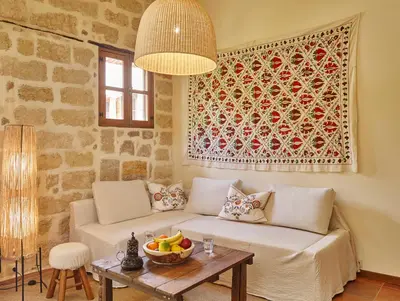 a living room with a couch and a table at Helios Garden Boutique Apartments in Rhodes Town