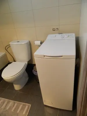 a small bathroom with a toilet and a sink at Kalithies apartment in Kalithies