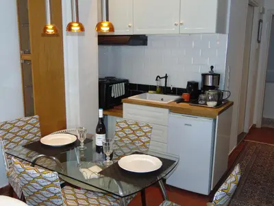 a kitchen with a table with two plates on it at Danezis City Stars Boutique Aparthotel in Rhodes Town