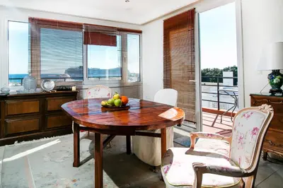 a kitchen with a wooden table with a bowl of fruit on it at Danezis City Stars Boutique Aparthotel in Rhodes Town