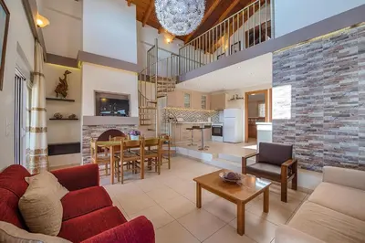 a living room with a couch and a table at Villa Fay in Lardos