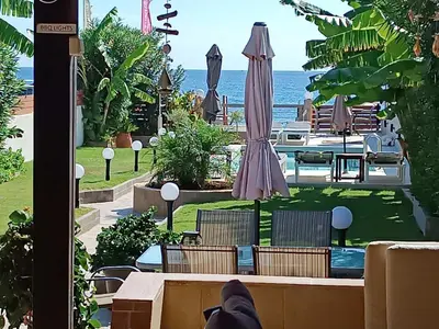 a view of the ocean from the balcony of a resort at Villa Fay in Lardos