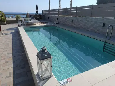a swimming pool with a light in the middle at Villa Fay in Lardos