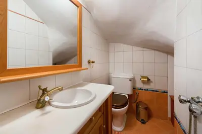 a bathroom with a sink and a toilet at Villa Zoi in Gennadi