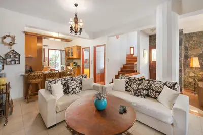 a living room with two couches and a table at Villa Zoi in Gennadi