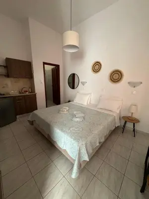 a bedroom with a large bed in a room at Fedra Apartments Lindos in Líndos