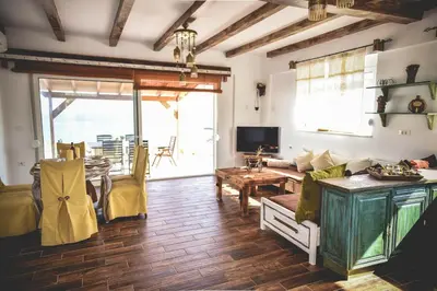 a living room with a couch and a table at Casa di Mare Stegna in Archangelos