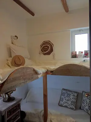 a bedroom with a bunk bed in a room at Casa di Mare Stegna in Archangelos