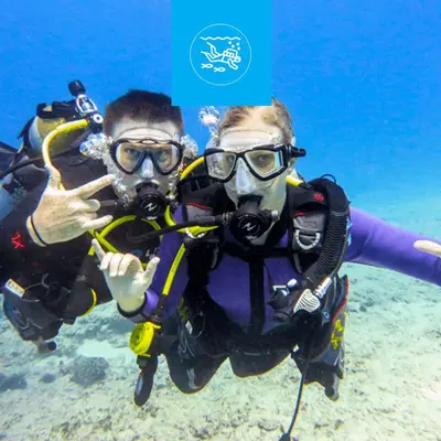 two people in snorkelling in the ocean at The Grandma House in Ialyssos