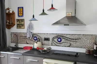 a kitchen with a sink and a stove top oven at Pefkos Eye in Pefki Rhodes