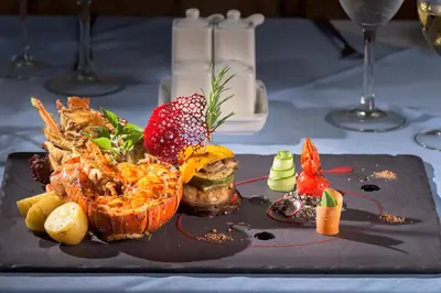 a plate of food sitting on a table with food at Atrium Palace Thalasso Spa Resort And Villas in Kalathos