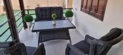 a balcony with a table and two chairs at M&B Luxury House in Theologos