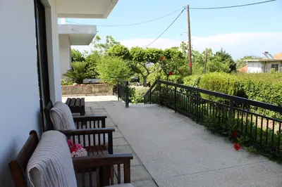 a balcony with two benches and a fence at Salakos Mountain View Home in Sálakos