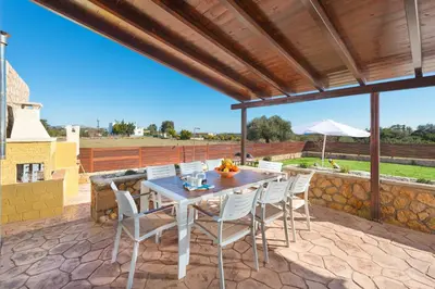 a table and chairs on a patio with a view at MarySol Luxury Villa in Gennadi