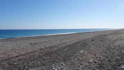 a rocky beach with the ocean in the background at MarySol Luxury Villa in Gennadi