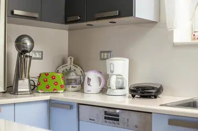 a kitchen counter with various appliances on it at EVA's House in Pastida
