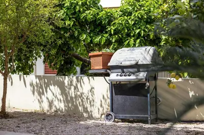 a grill with a pot on top of it at EVA's House in Pastida