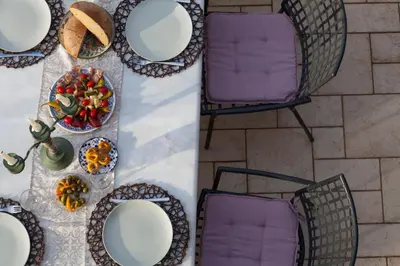 an overhead view of a table with plates and chairs at Medieval Dreams Villa in Rhodes Town