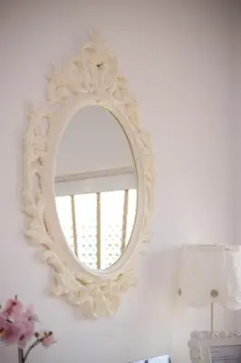 a white mirror on a wall in a room at Filerimos House in Ialyssos