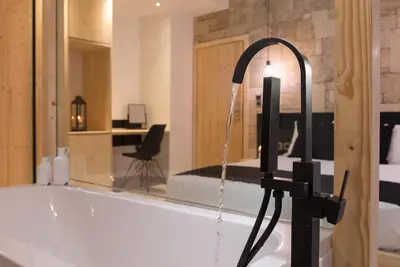 a bathroom with a bath tub with a water fountain at Old Town Senses Boutique Hotel in Rhodes Town