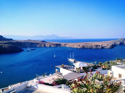a view of a large body of water at Apostolos Rooms in Líndos