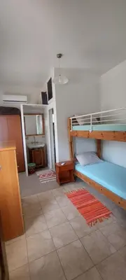 a room with two bunk beds and a bathroom at 