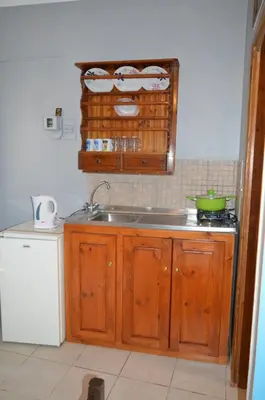 a kitchen with a sink and a counter top at 